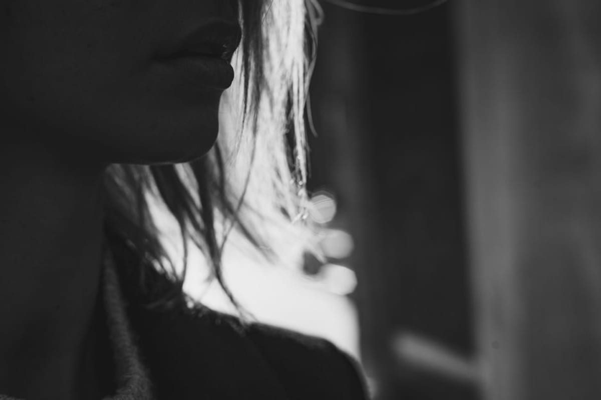 Profile view of a jaw and neck, face cropped above the lips